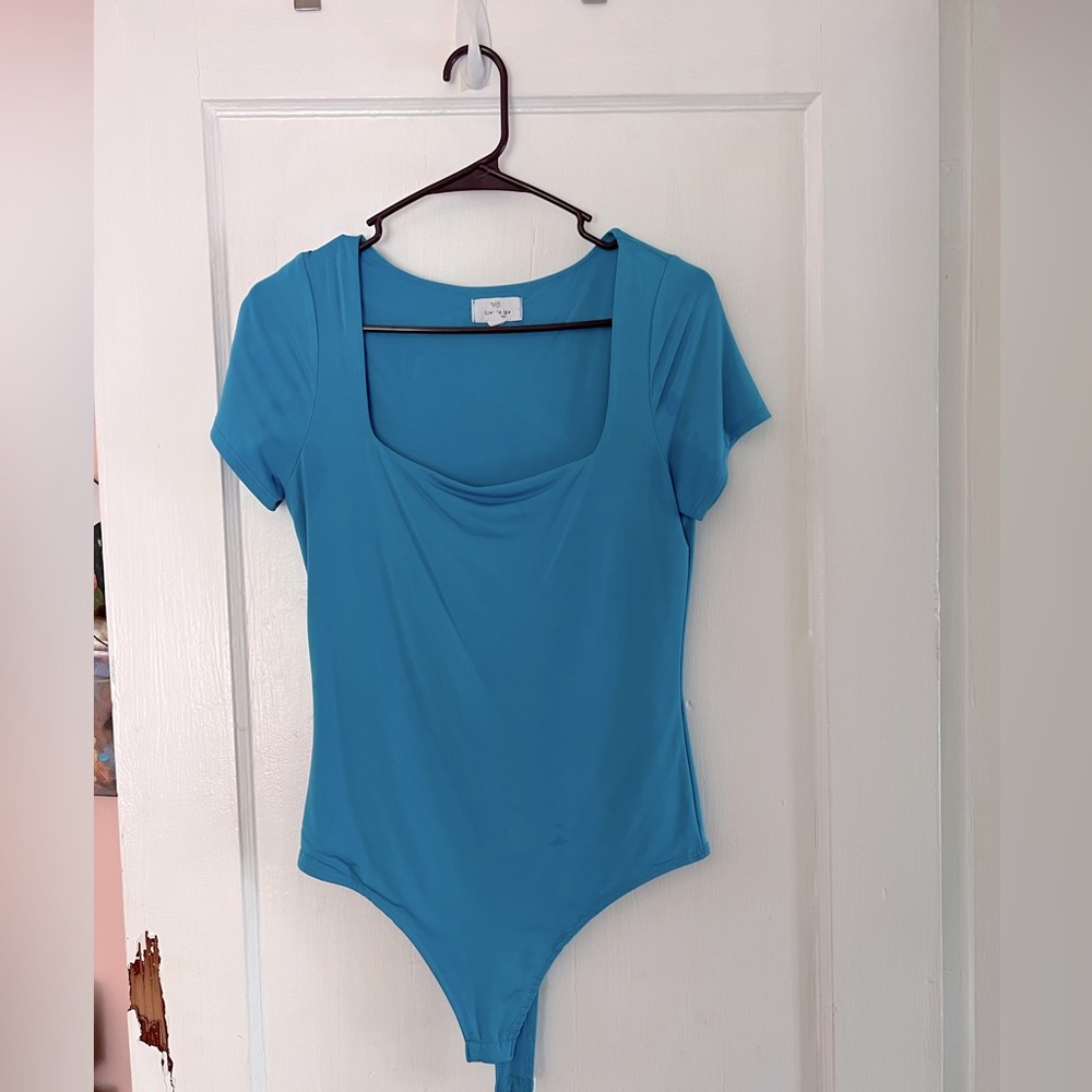 L blue short sleeved bodysuit